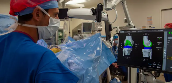 Robot-assisted knee replacement system in an operating theatre